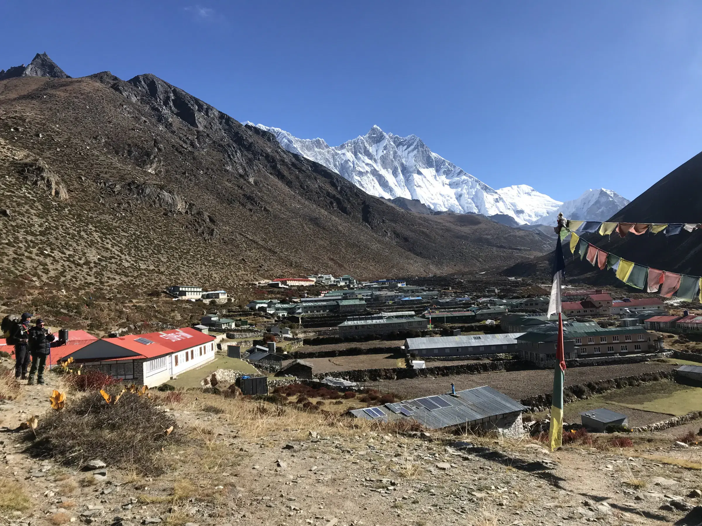 Mountain landscape featuring rocky terrain and blue sky.