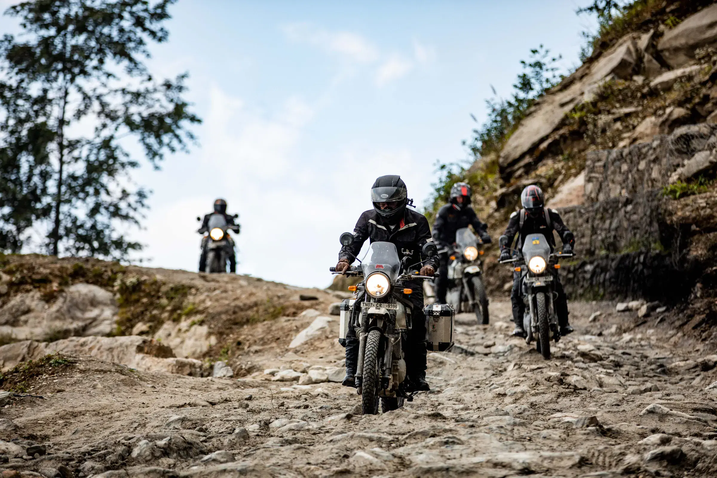 Outdoor scene featuring people and cloudy sky.