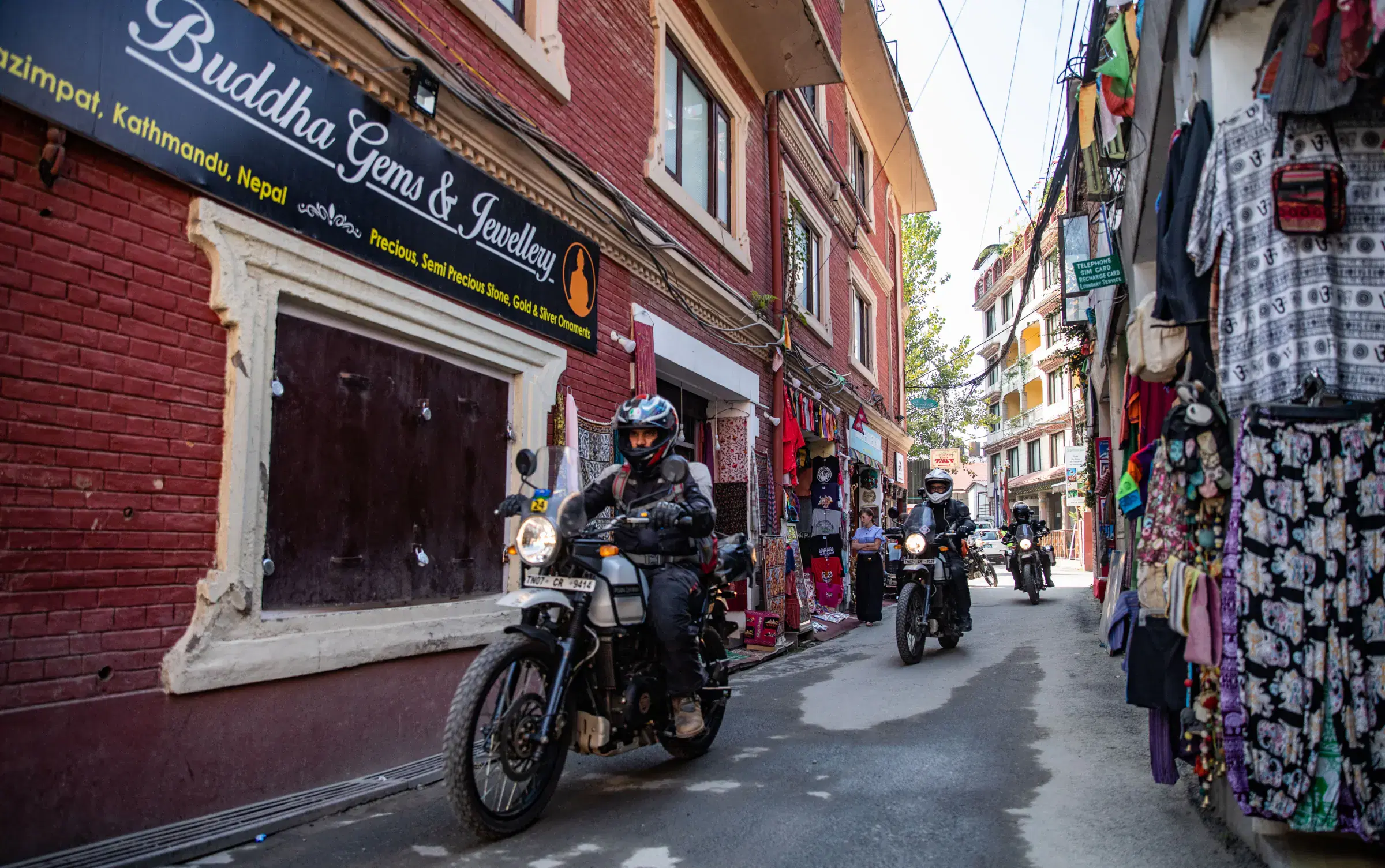 Outdoor scene featuring people and a built structure.