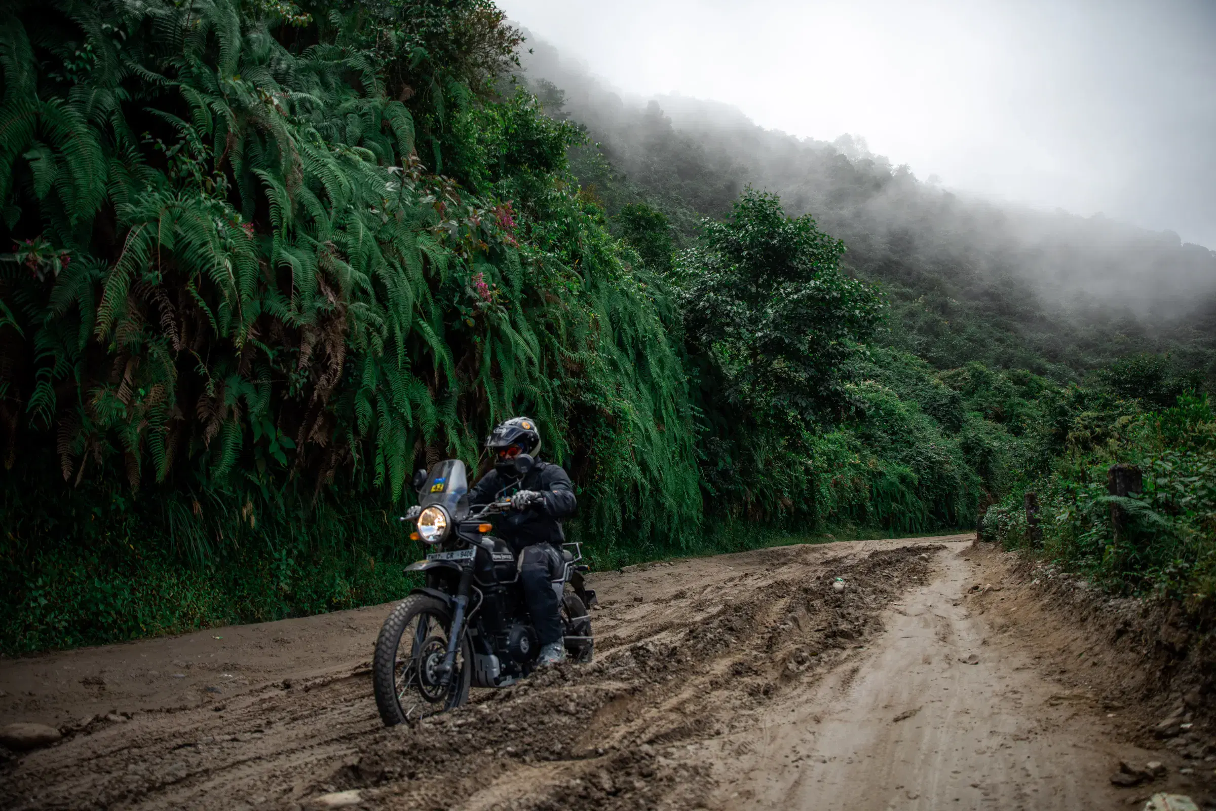 Outdoor adventure scene featuring people and a vehicle.