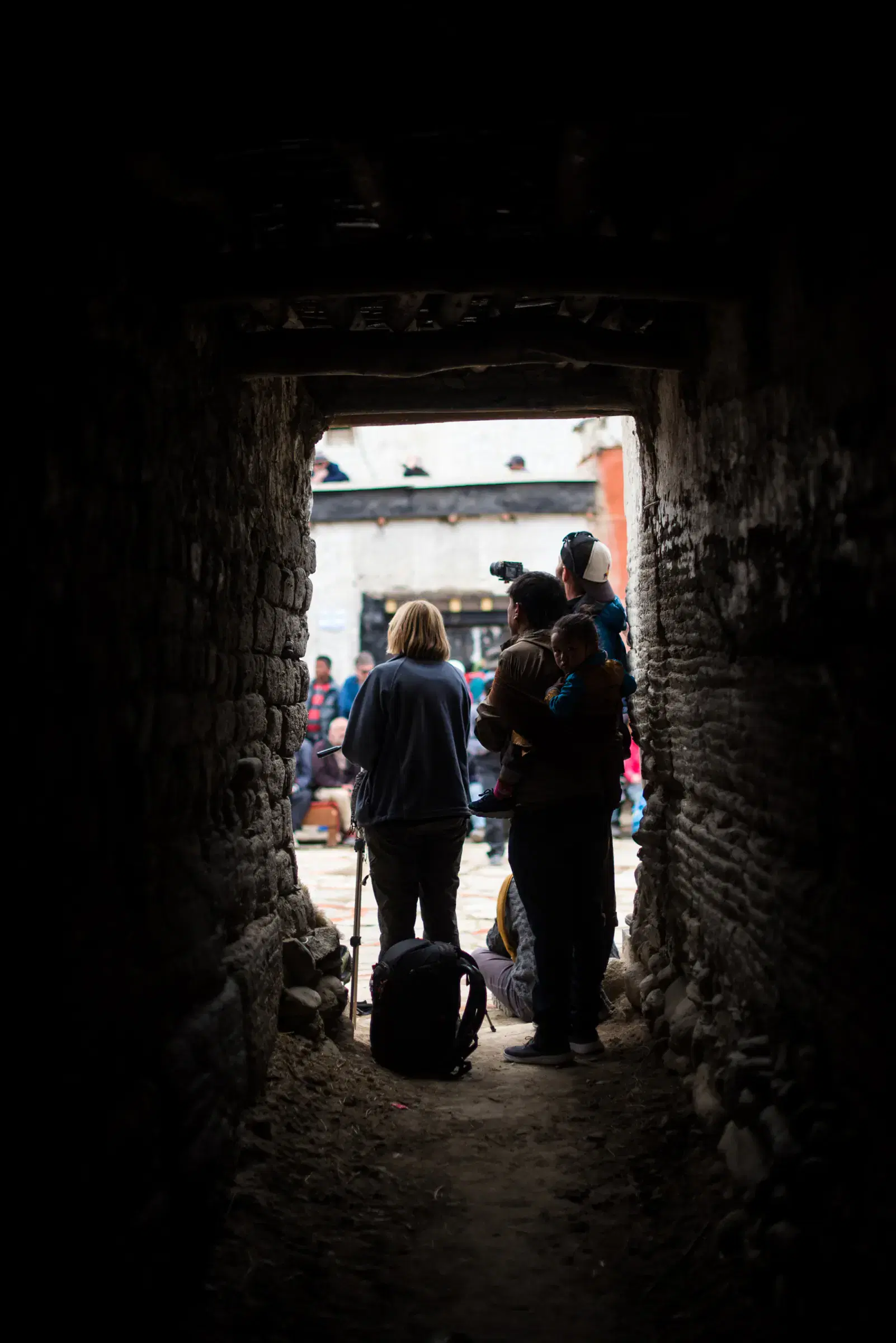 Portrait-oriented Outdoor scene featuring people.