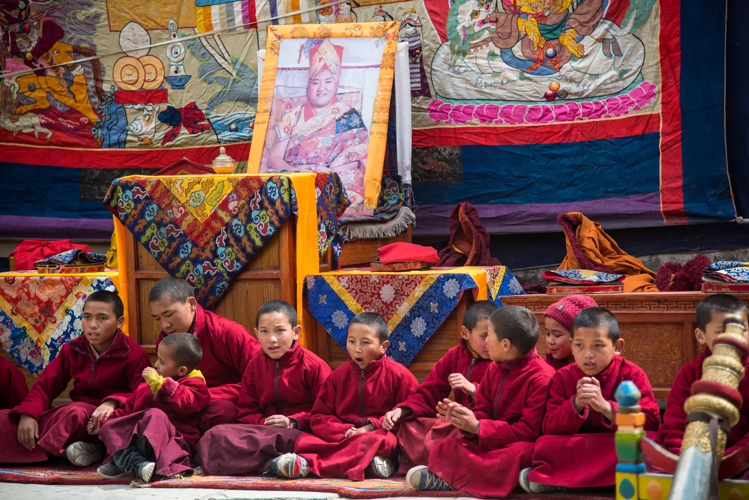 Outdoor scene featuring people and a built structure.