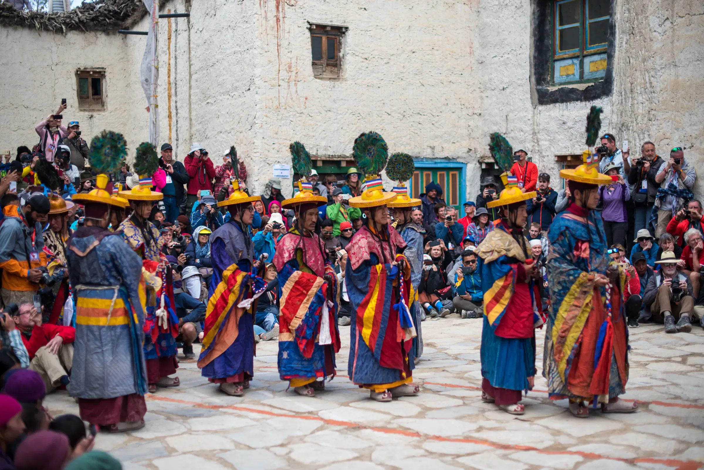 Outdoor scene featuring people and a built structure.