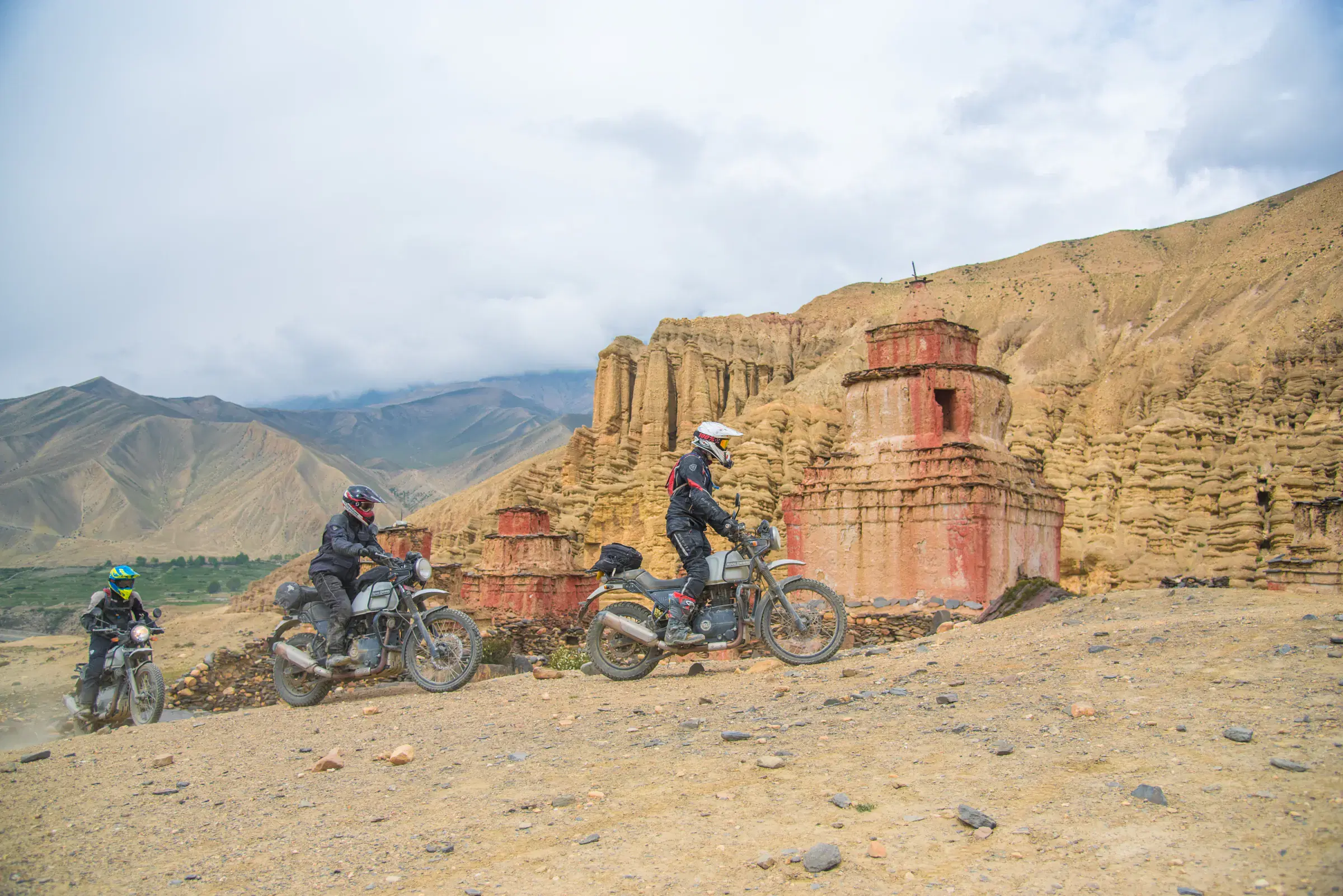 Outdoor scene featuring people and cloudy sky.