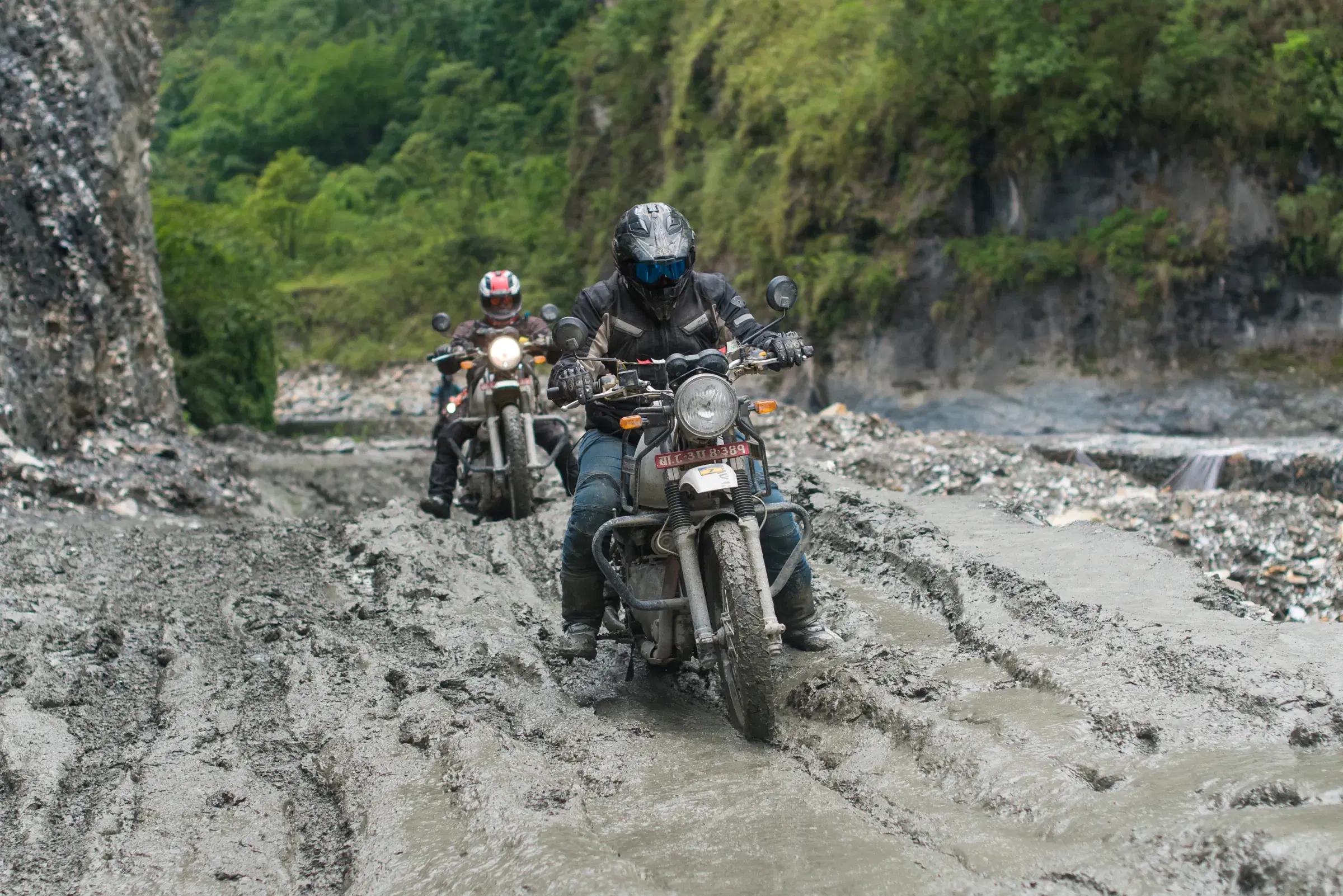 Outdoor adventure scene featuring people and a vehicle.