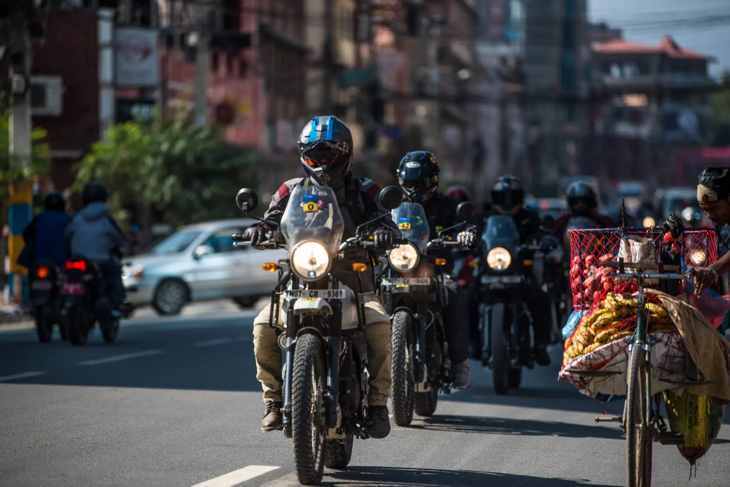 Outdoor adventure scene featuring people and a vehicle.