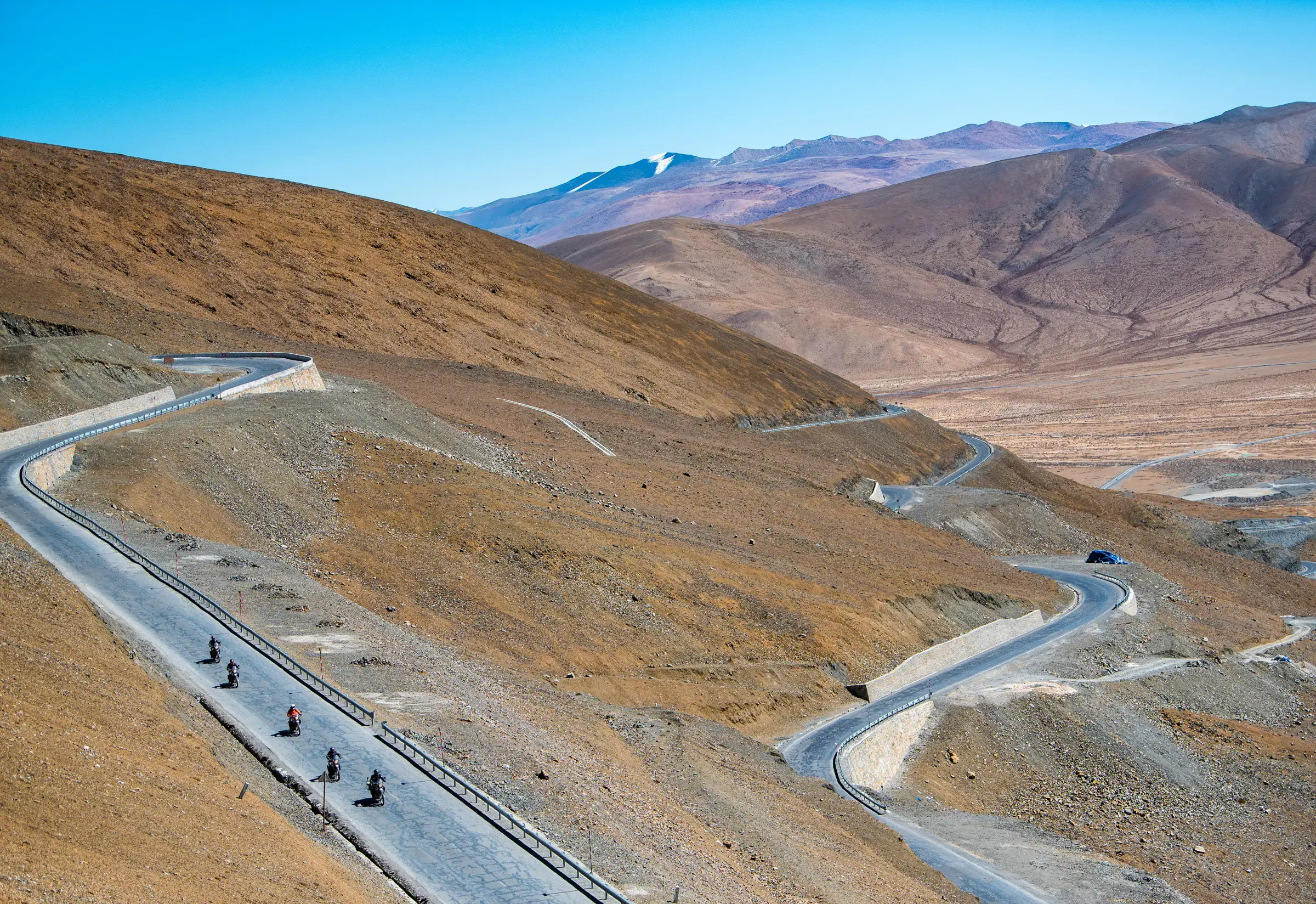 Mountain landscape featuring rocky terrain and blue sky.