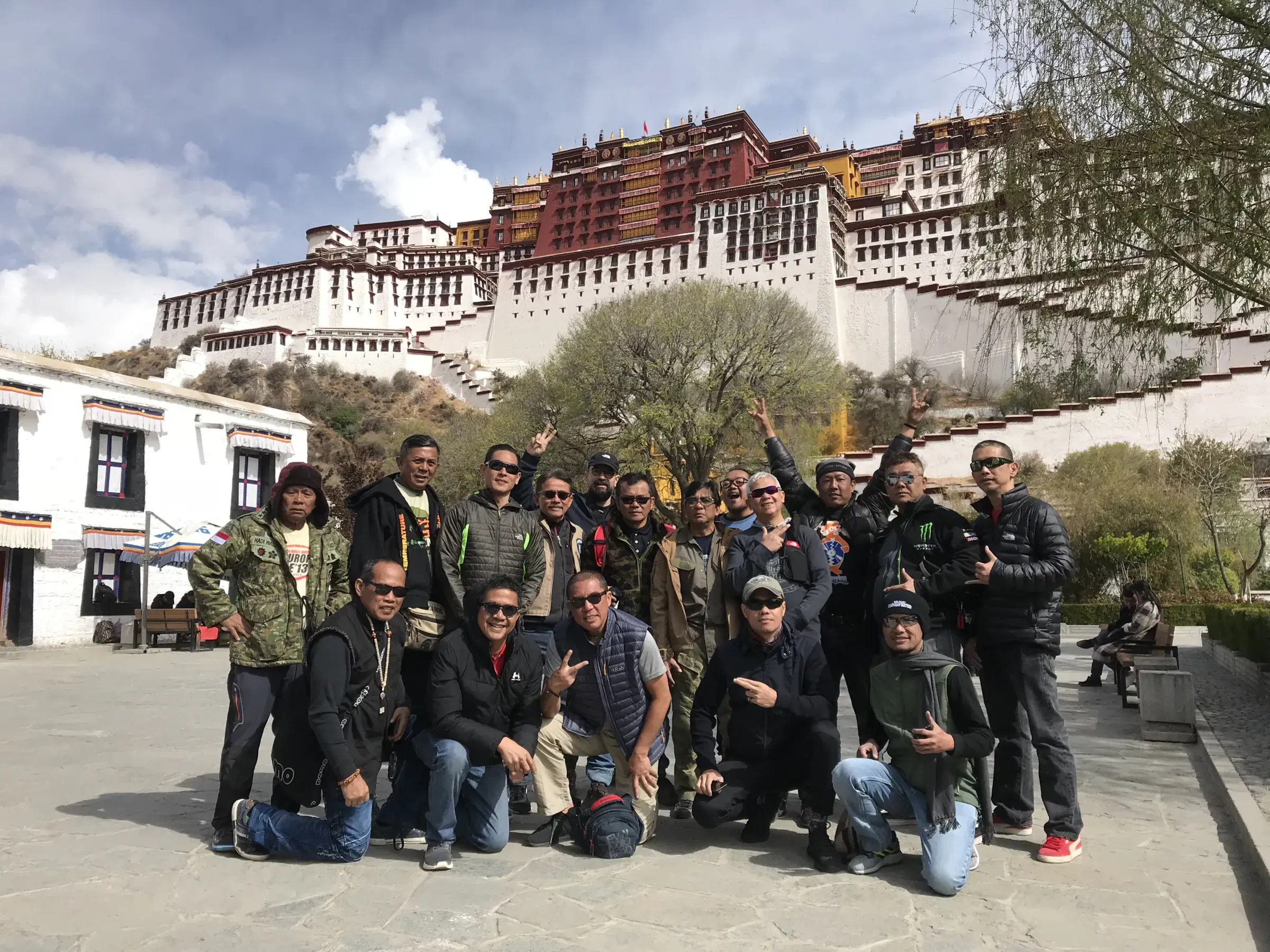 Outdoor scene featuring people and cloudy sky.